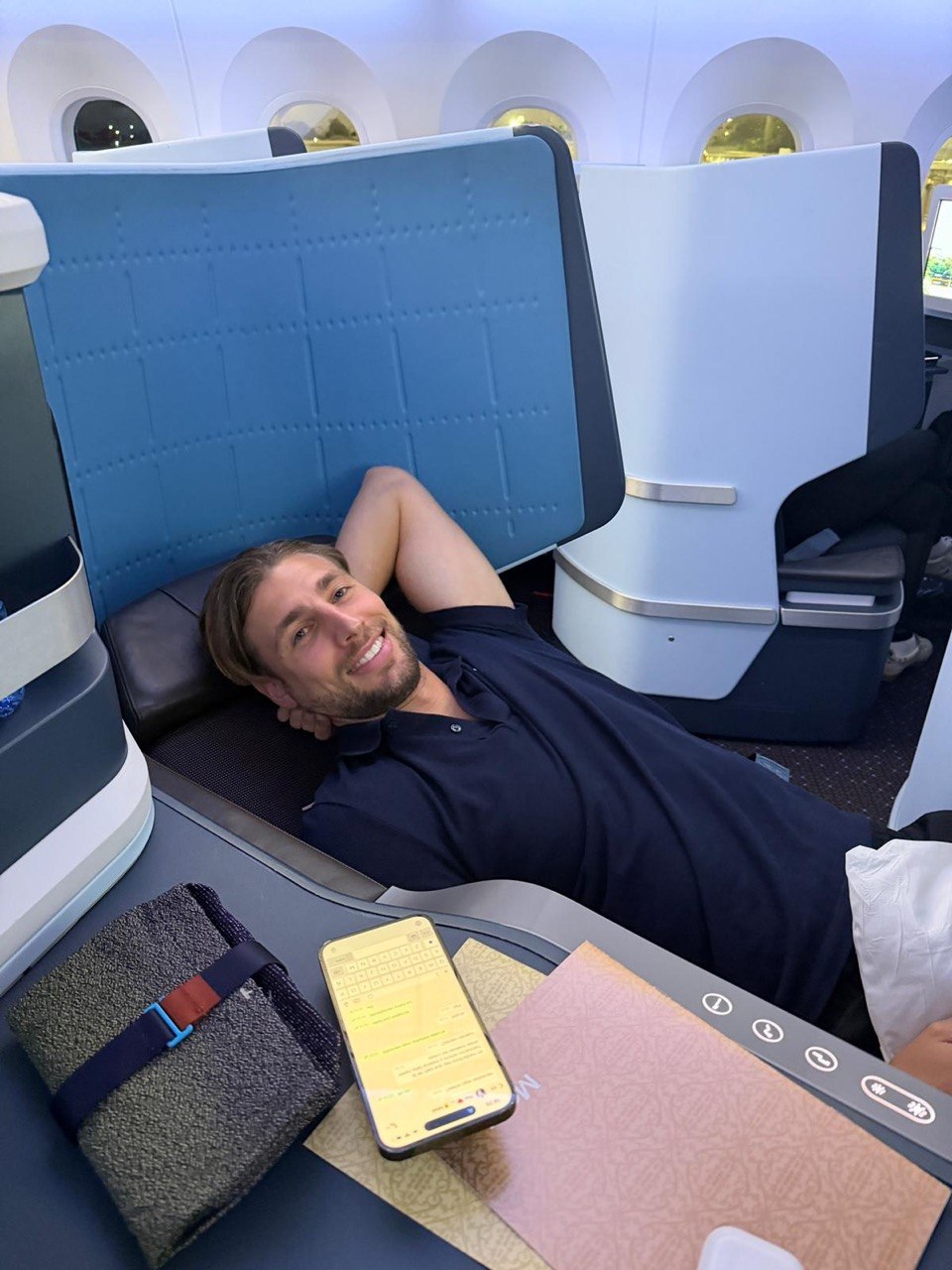 Client enjoying business class flat bed